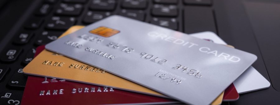 Credit,Cards,On,The,Laptop,Keyboard.,The,Concept,Of,Convenience